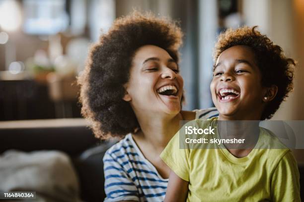 Cheerful African American Mother And Daughter At Home Stock Photo - Download Image Now