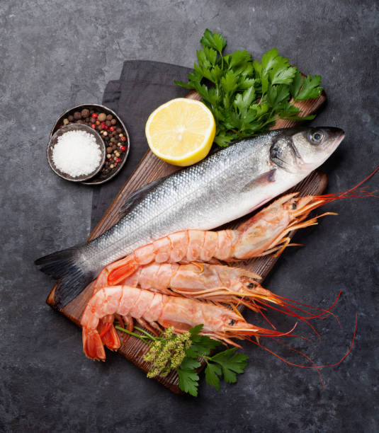 istock Fresh seafood. Trout fish and langostino shrimps 1164841232