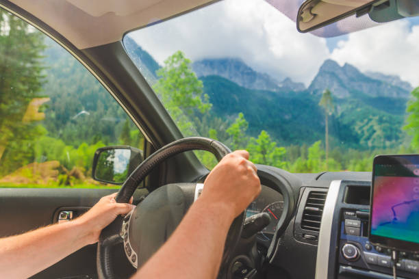 istock view from car inside navigation on phone mountains on background 1164841540