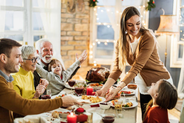istock Happy multi-generation family having Thanksgiving lunch in dining room. 1164844539