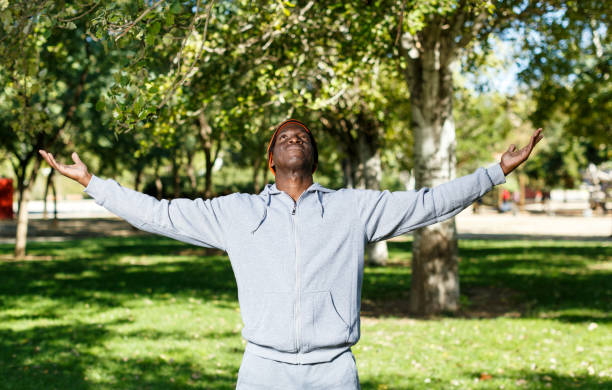 istock Athletic male man standing and spread his hands to the sides 1164846007