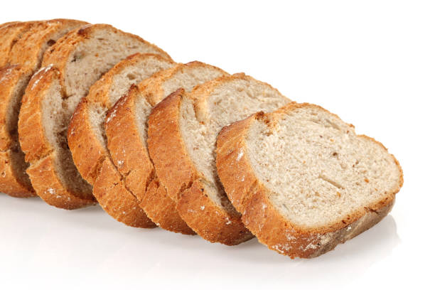 istock Sliced floury wheat bread isolated on white 1164846294