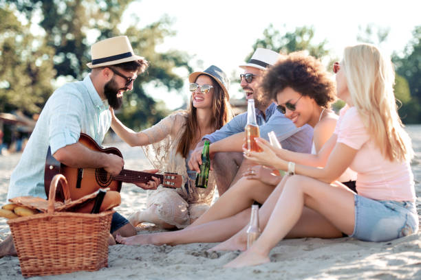 istock Friends having great time on the beach 1164846379
