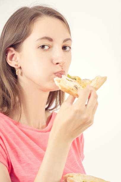istock girl with pizza 1164846452