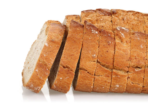 istock Sliced floury wheat bread isolated on white 1164846524