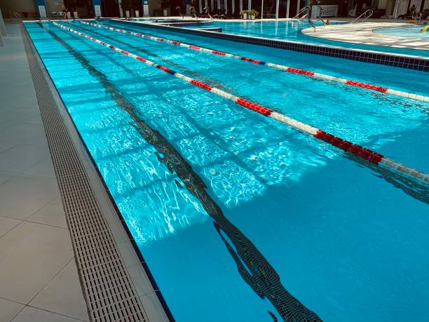istock View of covered swimming pool with blue clean water. Spa centre 1164847167