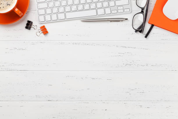 istock Office workplace with coffee, supplies and computer 1164847226