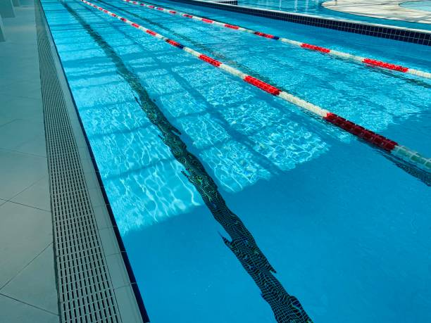 istock View of covered swimming pool with blue clean water. Spa centre 1164847460