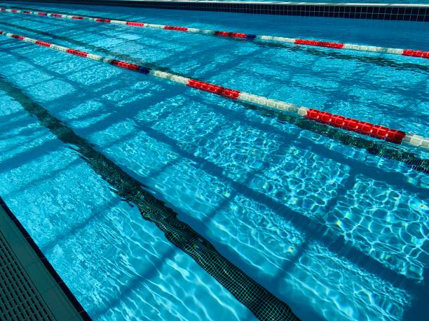 istock View of covered swimming pool with blue clean water. Spa centre 1164847467
