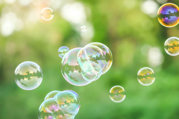 istock soap bubbles on green nature background 1164847694