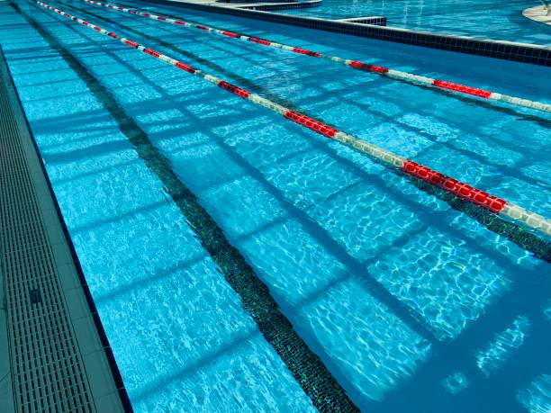istock View of covered swimming pool with blue clean water. Spa centre 1164847698