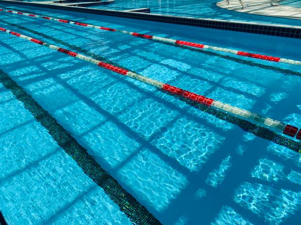 istock View of covered swimming pool with blue clean water. Spa centre 1164847714