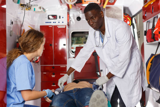 istock Paramedic team  providing first aid to man 1164849182
