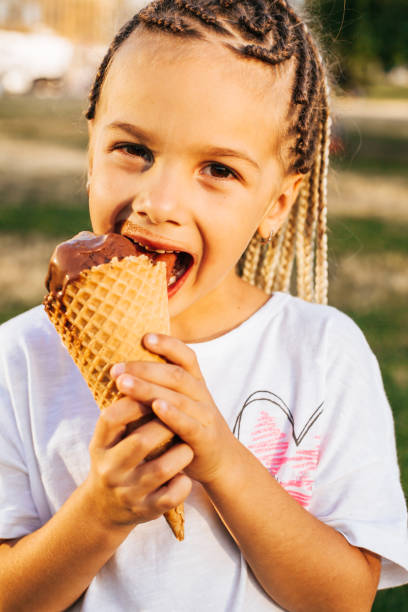 istock girl eating a big ice cream 1164850013