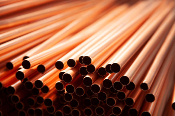 Copper pipes in factory, industrial background stock photo