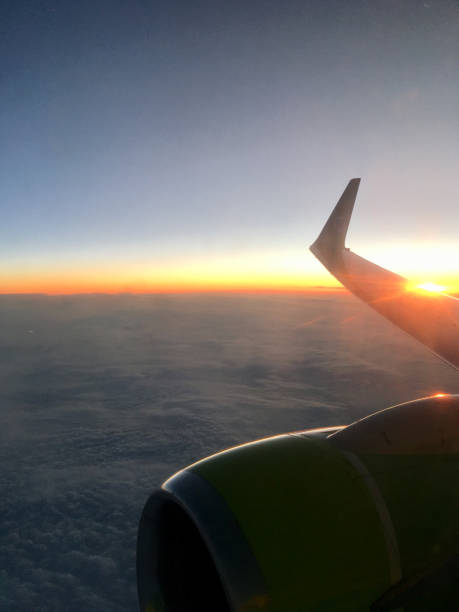 istock Airplave win in the sunset skies. 1164850639