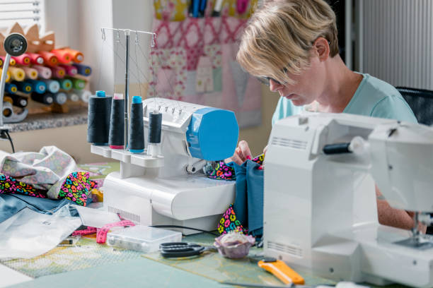 istock Woman working on sewing machine at home 1164851138