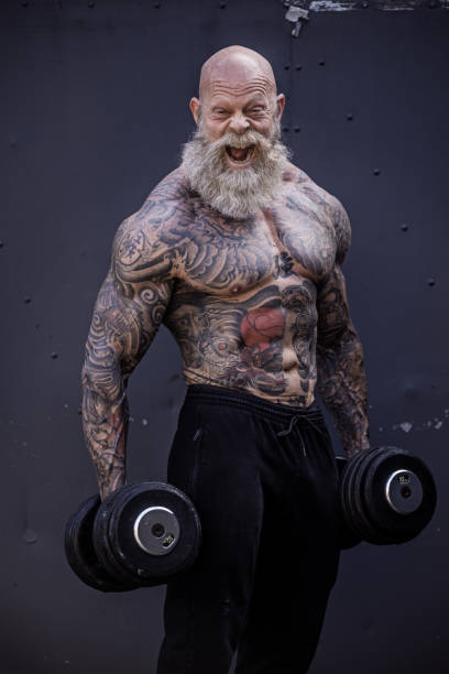 istock Tattooed Senior Man During Gym Workout 1164852299