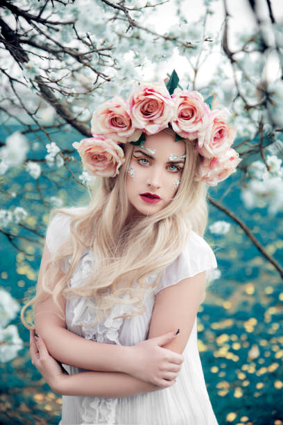 istock Blonde woman with flower crown 1164852695
