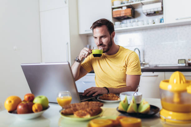 istock Portrait of smiling man working at home 1164858333