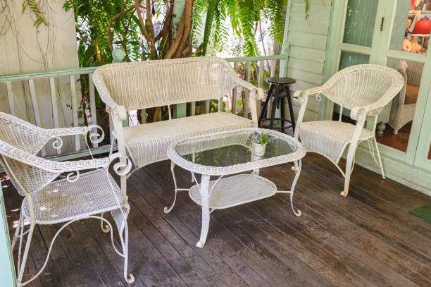 istock Antique weaving chairs with table on wood patio 1164860489