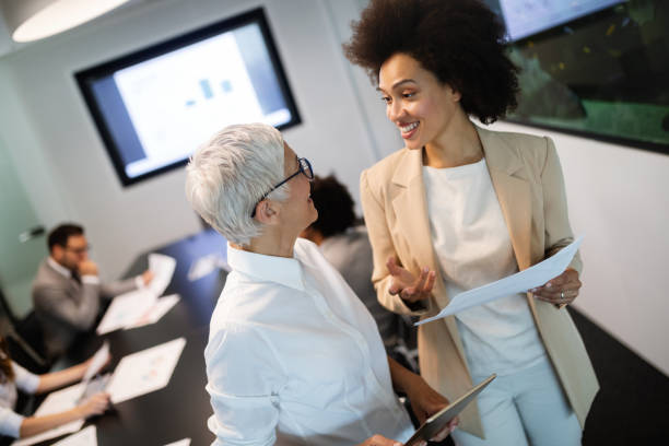 istock Group of successful business people at work in office 1164861879