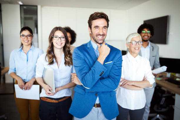 istock Group of successful business people in office 1164861997