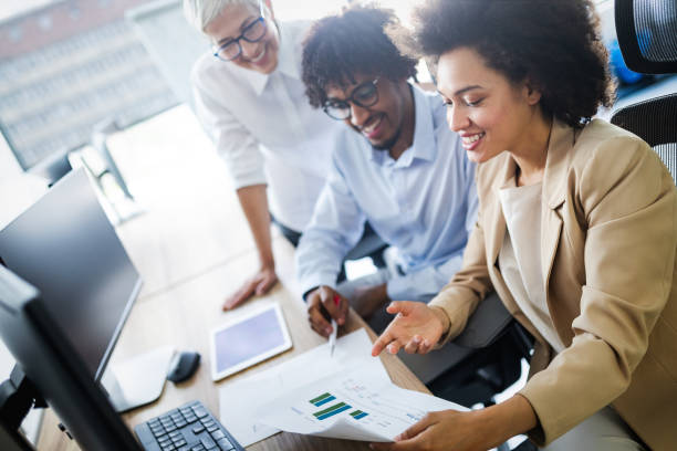 istock Successful business group of people at work in office 1164862876