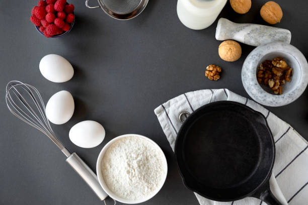 istock Baking Cake Ingredients Laid Out On A Dark Background 1164865738