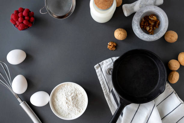 istock Baking Cake Ingredients Laid Out On A Dark Background 1164865742