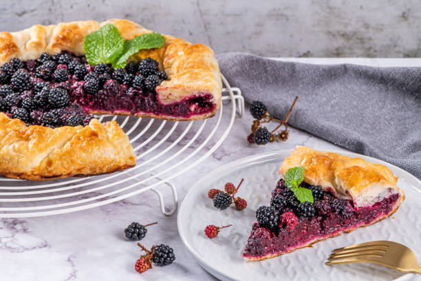 istock Blackberries pie. Pie in summer with fresh picked wild blackberries. 1164866098