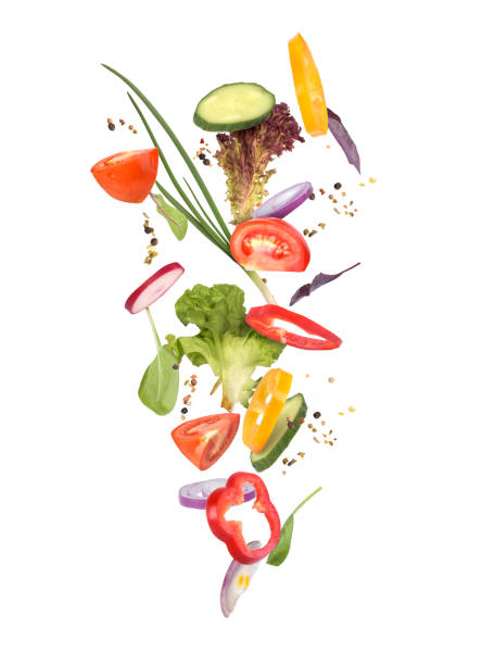 istock falling piees and sliced vegetables isolated, green salad 1164867975