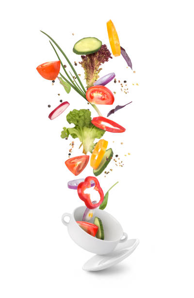istock green fresh salad falling on the white plate 1164867977