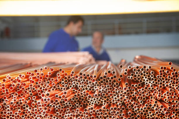 Copper pipes in factory, industrial background