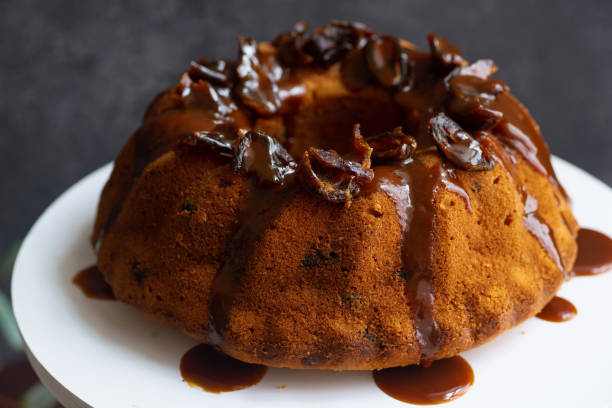 istock Festive bundt cake with dates and salted caramel. Sticky toffee pudding style 1164868326