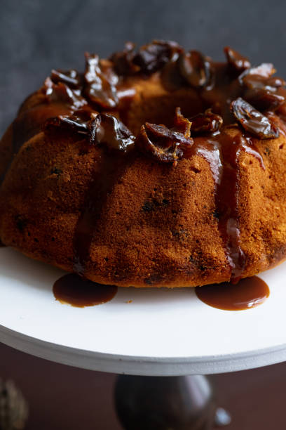 istock Festive bundt cake with dates and salted caramel. Sticky toffee pudding style 1164868334