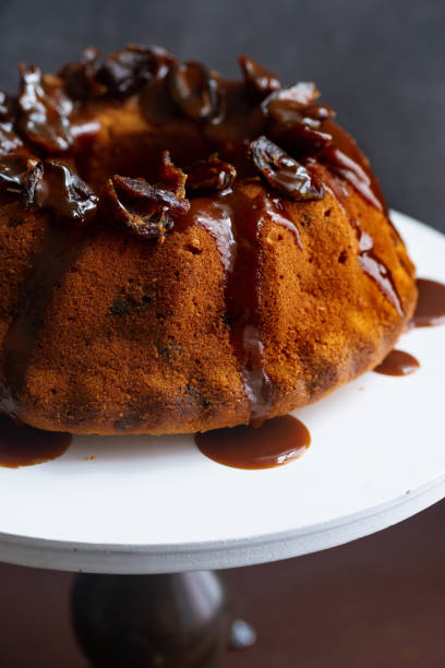istock Festive bundt cake with dates and salted caramel. Sticky toffee pudding style 1164868340