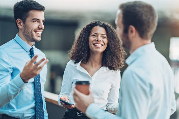 istock Group of smiling business persons 1164869646