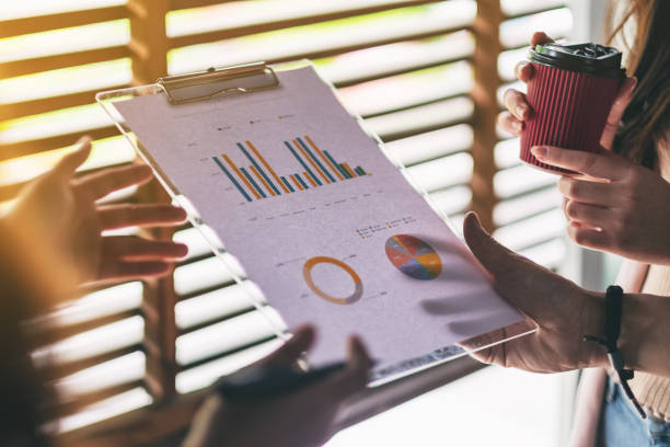 istock businessman working and discussing about business data 1164870816