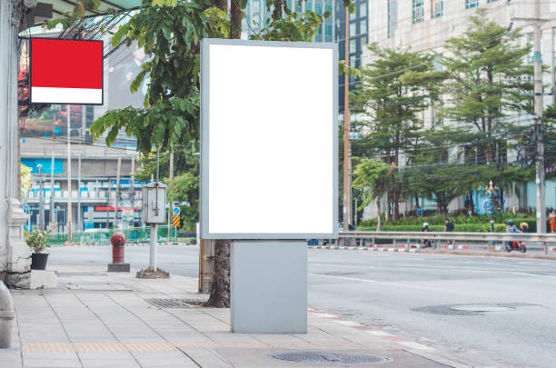 istock led blank billboard white screen side road in city. ad mockup copy space for advertising banner near bus stop in metropolis. 1164872303