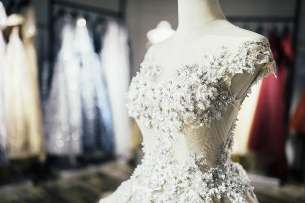 Elegant lace dress on dummy in wedding fashion shop. Wedding Dress, Dress, Store, Bridal Shop, Clothing, Close-Up, Beauty chinese wedding dress stock pictures, royalty-free photos & images