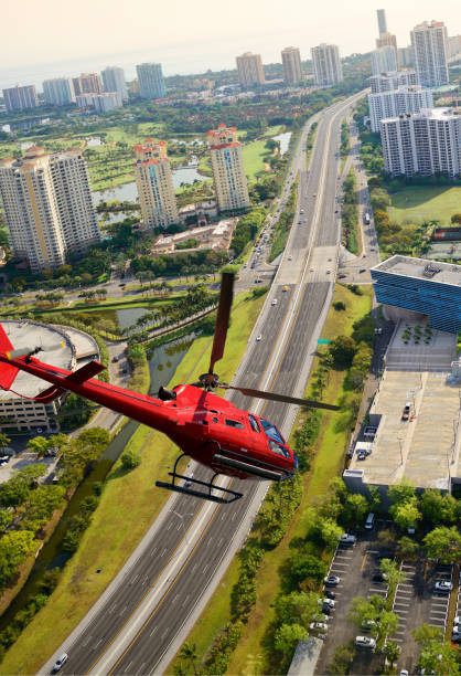 istock Helicopter flying over Interstate, Miami, Florida, USA. 1164874658