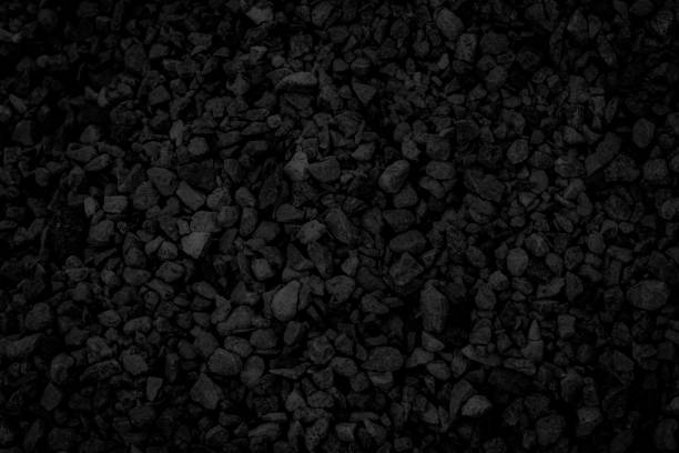 istock texture of a black stone wall, dark background for design. 1164875058
