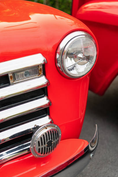 istock Close-up of Classic red car headlights. 1164876052