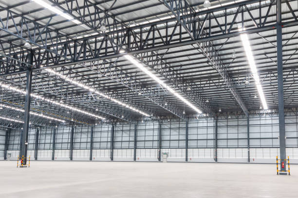 istock Empty warehouse. Factory building or warehouse building with concrete floor for industry. Industrial concept 1164876055