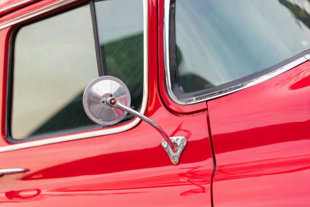 istock Side mirrors of classic red car. 1164876078