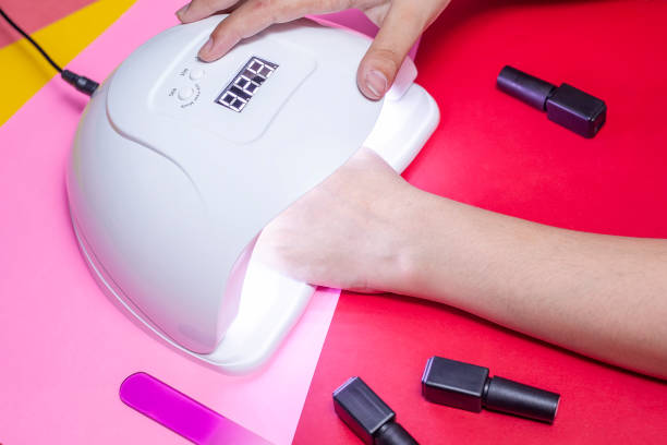 istock Manicure procedure. Woman Nail Polish. Shellac finger nails 1164880115