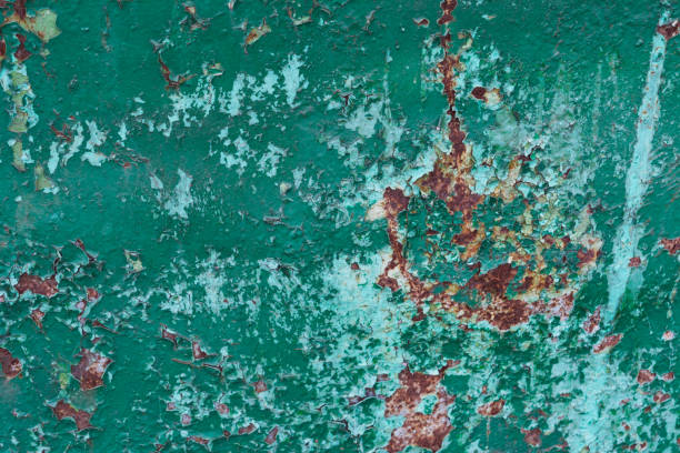 istock Green and blue cracked paint rusted texture 1164881026