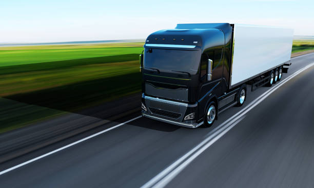 istock semi-truck with trailer driving on road 1164881041