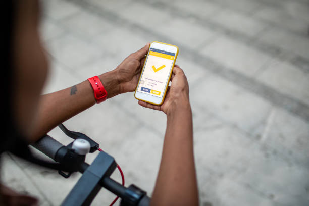 istock African Delivery Woman Holding Smart Phone And Checking Mobile App 1164881177